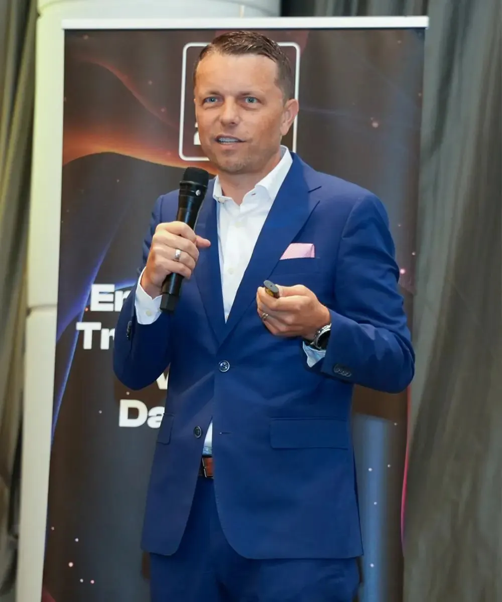 Speaker holding a microphone at a Data Innovation Summit session