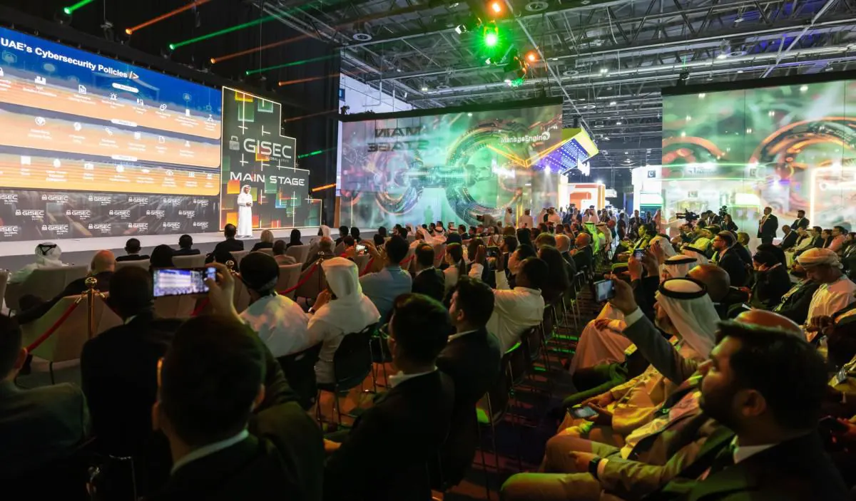 Audience watching a presentation at the GISEC main stage